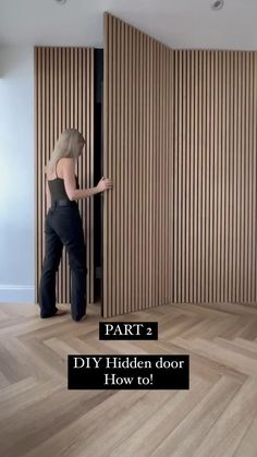 a woman standing in front of a wooden door with the words part 2 diy hidden door how to