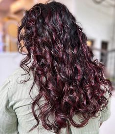 40 Dyed Curly Hair Ideas To Try In 2024 Long Curly Hair With Red Highlights, Hair Colour On Curly Hair, Red Highlights On Dark Curly Hair, Dark Red Highlights In Brown Hair Curly, Cherry Cola Hair Color Curly, Red Highlights On Dark Hair Curly, Red Highlights Curly Hair, Curly Hair Color Ideas Balayage, Hair Color Ideas For Curly Hair