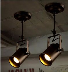 three lights hanging from the ceiling in a room