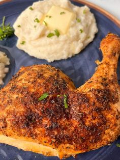 a blue plate topped with chicken, mashed potatoes and broccoli