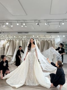 the bride is getting ready to walk down the aisle in her wedding dress and veil