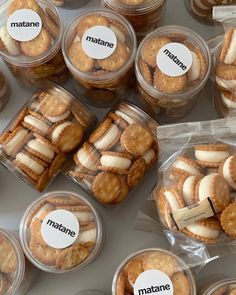 many small plastic containers filled with cookies and crackers