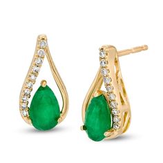 Illuminate in regal elegance with these gemstone and diamond earrings. Fashioned in warm 10K gold, each charming earring showcases a 6.0 x 4.0mm pear-shaped verdant-green emerald centered in an open teardrop-shaped frame of polished and shimmering diamond-adorned ribbons. Captivating with 1/15 ct. t.w. of diamonds and a brilliant buffed luster, these post earrings secure comfortably with friction backs. Elegant Earrings With Diamond Accents For May Birthstone, Elegant Diamond-accented Earrings For May Birthstone, Elegant May Birthstone Earrings With Diamond Accents, Elegant Diamond Earrings With Gemstone Accents For Anniversary, Elegant Green Diamond Earrings In 14k Gold, Elegant Diamond Earrings For May Birthstone, Elegant Pear-shaped May Birthstone Earrings, Yellow Gold Pear-shaped May Birthstone Earrings, Elegant Teardrop May Birthstone Earrings