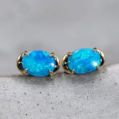 Minimalist Australian Boulder Opal Earrings 18K Yellow Gold. Free Domestic USPS First Class Shipping! Free Gift Bag or Box with every order!Opal—the queen of gemstones, is one of the most beautiful gemstones in the world. Every piece of opal is unique in its own ways and patterns. We only use high-quality Natural Opals (NO synthetics or imitations) for our jewelry. ----------------------------------------------------------------------------------------------------ABOUT THIS PRODUCTSolid 18k Yellow GoldAustralian Boulder Opal, 2.26 ctEarrings Size: 10x6 mmOpal Size: 7.5x6 mmOccasion: Birthday/Anniversary/Engagement----------------------------------------------------------------------------------------------------RING RE-SIZINGThere will be no re-sizing fee for custom-made orders.A small non Formal Opal Gemstone Earrings, Oval Opal Earrings In Yellow Gold, Yellow Gold Oval Opal Earrings, Yellow Gold Opal Gemstone Earrings, Opal Promise Ring, Australian Black Opal, Opal Birthstone, Beautiful Gemstones, Promise Rings For Couples