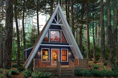 a - frame cabin in the woods is lit up at night with lights shining on it