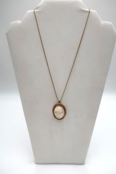 "For Sale: (1) t380 10k/14k 18\" Box Cameo Pendant Necklace PLEASE READ ENTIRE DESCRIPTION BEFORE PURCHASING Pre-owned item. Good condition. Please see pictures for details. Sold as is, as seen on pictures. No returns on vintage/antique items. Would be a nice, birthday, Christmas, Mother's Day or Valentine's Day gift for her.   This antique carved conch shell cameo portrait of a Bacchanalian maiden pendant is set in a 10K  gold bezel within a border of 10K yellow gold leaves and has a sturdy bail.  Those females who attended the festivals of Bacchus, the Greek God of wine and agriculture are often depicted with grapes in their hair.  The pendant is hung on 14k Gold Box Chain.The chain is stamped. Specifications : Metal : 10k & 14k Gold Pendant : 1 1/2\" x 1\" Chain : 14k Gold,Box Chain,18\ Formal Heirloom Necklace Stamped 14k, Fine Yellow Gold Cameo Jewelry, Formal Heirloom 14k Stamped Necklaces, Formal Yellow Gold Cameo Jewelry, Antique 14k Stamped Necklaces For Formal Occasions, Antique 14k Gold Necklaces For Formal Occasions, Heirloom Cameo Necklace In Yellow Gold, Antique Yellow Gold Cameo Necklace, Heirloom Yellow Gold Cameo Necklace