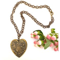 This heart necklace features a large vintage inspired heart medallion. the necklace is 22" in length and closes with a toggle clasp. The heart is 2.25" wide and 2.5" in length. It is perfect for anyone who loves vintage and also the cottagecore look. Luxury Antique Necklaces With Heart Charm, Antique Gold Heart Pendant Vintage Necklace, Vintage Antique Gold Heart Pendant Necklace, Vintage Necklace For Valentine's Day, Vintage Brass Necklace For Valentine's Day, Antique Gold Heart Necklace With Vintage Charm, Vintage Heart-shaped Brass Necklace, Vintage Brass Locket Necklace For Valentine's Day, Vintage Heart Necklace For Valentine's Day