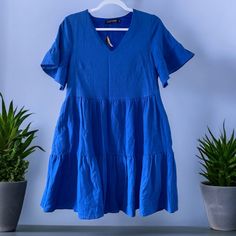 Fancyinn Ruffle Tiered Swing Shirt Dress Blue Size Xs Blue V-neck Tiered Dress With Ruffle Hem, Blue Cotton Dress With Ruffle Sleeves, Casual Blue Tiered Dress, Blue Mini Length Tiered Summer Dress, Blue Mini Tiered Dress For Summer, Casual Blue Tiered Summer Dress, Blue Ruffle Sleeve Dresses For Day Out, Blue Cotton Tiered Dress With Ruffle Hem, Blue V-neck Tiered Summer Dress