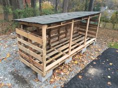 two wooden pallets stacked on top of each other in the middle of a forest