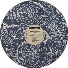 the crown records label is shown on a blue and white circular plate with palm leaves