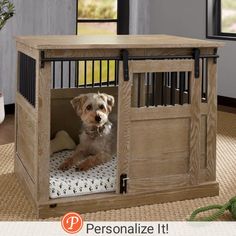 a small dog is sitting in his crate