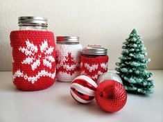 red and white knitted jars with christmas decorations