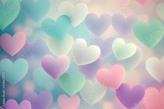 many hearts are floating in the air on a blurry blue, pink and green background