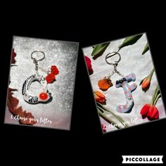 two key chains with the letter e on them, one is decorated with flowers and leaves