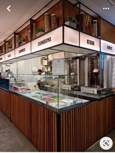 the inside of a restaurant with food on display