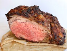 a piece of meat sitting on top of a brown paper bag