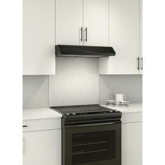 a black stove top oven sitting in a kitchen next to white cupboards and counter tops