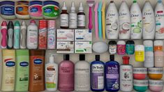 an open drawer containing many different types of cosmetics and lotion bottles, including toothpaste