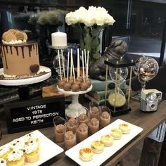 desserts and pastries are displayed on the table