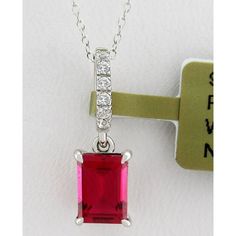 Karat: .925 Sterling Silver Gemstones: 1 Created Ruby - 1.05 Carats Ruby Grades, Hue . . . Red Tone . . . Medium Saturation . . . Vivid Cut . . . Excellent No Inclusions Or Flaws 6 Created White Sapphires - 0.01 Ct Each Net Weight: 1.5 Grams Shape: Emerald Cut & Round Setting: Prong & Shared Prong Dimensions : 7 Mm X 5 Mm - Main Gemstone Measurements 18 Mm (0.70") - Bail Included X 5 Mm (0.19") // Chain 18" Long Chain Is A Complimentary Gift Made Of Silver - 18" Long Appraisal Available For A Lo Dazzling Gia-certified Ruby Jewelry, Dazzling Gia Certified Ruby Jewelry, Classic Red Gia Certified Jewelry, Classic Necklace With Lab-created Ruby, Red Brilliant Cut Gemstones For Anniversary, Gia Certified White Gold Jewelry For Valentine's Day, Red Brilliant Cut Gemstone For Gift, Classic Jewelry With Gia Certified Lab-created Ruby, Red Emerald-cut Sterling Silver Jewelry