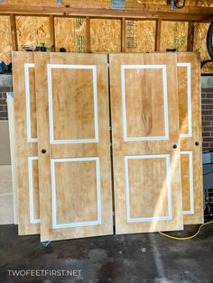 two unfinished doors are sitting in the garage