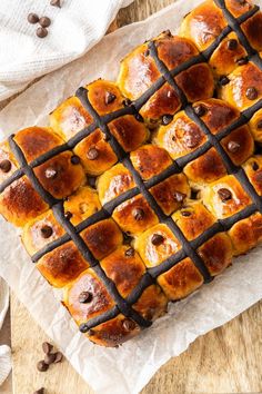 a close up of a pastry on a table with chocolate chips and coffee beans around it