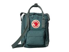 Fjallraven Kanken Sling - Cross Body Handbags : Frost Green : Grab a few quick essentials with the Kånken Sling. Small main compartment hidden zip compartment to hold all your daily essentials. Front zip pocket for additional storage. Dual top handles with snap closure for toting. Adjustable single shoulder strap for a comfortable fit. Fjällräven logo patch on front. Volume: 2.5 L. Materials: 100% Vinylon-F. Imported. Measurements: Bottom Width: 6 in Depth: 3 in Extended Depth: 8 in Strap Length Fjallraven Sling, Fjallraven Kanken Sling, Kanken Sling, Fjällräven Kånken, Daily Essentials, Fjallraven Kanken, Fjallraven Kanken Backpack, Cross Body Handbags, Snap Closure