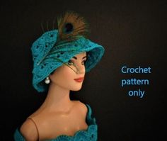 a mannequin head wearing a blue crochet hat with feathers on it