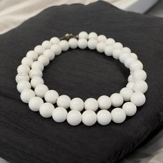 Indulge in the timeless beauty of our natural white coral necklace. Crafted with exquisite 8mm smooth round coral beads, this piece exudes elegance and sophistication. The soft white hue of the coral adds a touch of serenity and grace to any outfit.   Key features: * Natural white coral beads * 8mm Smooth, round shape * Elegant design * High-quality craftsmanship * Soft white color * Calming and balancing properties   Perfect for: * Daily wear * Special occasions * Gift-giving   Order yours toda Formal White Beaded Necklaces With Round Beads, White Beaded Necklaces For Formal Occasions, White Formal Beaded Necklace, White Minimalist Beaded Gemstone Necklace, Minimalist White Gemstone Beaded Necklaces, Classic White Polished Bead Necklaces, Classic White Polished Beads Necklaces, Classic White Necklaces With Polished Beads, White Round Beaded Necklace 8mm