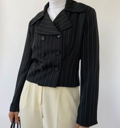 "Vintage striped cropped double breasted blazer with oversized collars. In great condition, minimal wear. Measurements: Size: 6 Shoulder to shoulder: 17.5\" Length: 18\" Sleeve: 22\" Material: 100% Polyester Vintage and pre-loved items are one of a kind and may have minor imperfections. The color of the item may slightly vary due to lighting. The model in the photo wears a size XS/S and is 5'3\". We cannot be certain that an item will fit you. Please refer to the measurements. All Sales Final" Striped Double-breasted Long Sleeve Blazer, Double-breasted Striped Outerwear For Office, Striped Double-breasted Outerwear For Office, Chic Striped Double-breasted Blazer, Fall Striped Blazer With Double Button Closure, Striped Outerwear With Suit Collar For Office, Fall Striped Double-breasted Blazer, Vintage Striped Workwear Blazer, Vintage Striped Blazer For Work