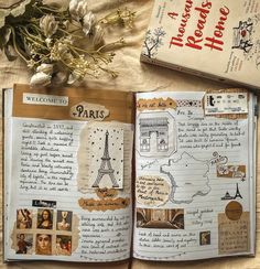 an open book with pictures and writing on it next to a bouquet of white flowers