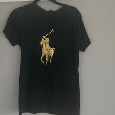 Short Sleeve, 100 Percent Mercerized Cotton, Large Metallic Gold Logo. Size Is Xl But Fits More Like A Generous Medium. Never Worn Fitted Black Ralph Lauren Top, Gold Logo, Ralph Lauren Tops, 100 Percent, Short Sleeve Top, Black Shorts, Metallic Gold, Short Sleeves Tops, Sleeve Top