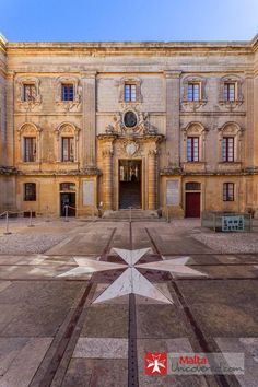 an old building with a star on the ground