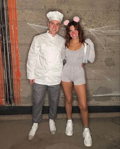 two people dressed in costumes standing next to each other with bunny ears on their head