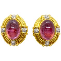 Classic 18 karat yellow gold clip on earrings, centering cabochon oval Pink Tourmalines and round brilliant Diamond accents. The earrings measure 1" x 1" approximately. Posts can be added. Stamped with the jewelers hallmark Pink Tourmalines weight apprx. 22.00 Diamond weight 0.55 carats Formal Gold Clip-on Cabochons, Luxury Cabochon Clip-on Earrings For Formal Occasions, Luxury Formal Clip-on Earrings With Cabochon, Luxury Round Cabochon Clip-on Earrings, Luxury Oval Clip-on Earrings For Anniversary, Formal Yellow Gold Gemstone Clip-on Earrings, Oval Cabochons For Formal Wear Fine Jewelry, Yellow Gold Oval Clip-on Earrings With Polished Finish, Formal Clip-on Earrings With Oval Cabochon