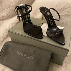 Tom Ford Lock Stiletto Sandals Brand New Never Worn Size 37.5 Comes With Original Packaging And Shoe Dust Bags * Tom Ford Sandal In Shiny Goatskin Leather. * Signature Hanging Padlock And Key Charm. * 4.3" Metallic Stiletto Heel. * Pointed Open Toe. * Single Band Upper. * Adjustable Halter Ankle Wrap. * Leather Outsole. * Made In Italy. * Fit Note: True To Size. Heel Height May Vary By Size. Tom Ford Heels Aesthetic, Tom Ford Heels, Tom Ford Shoes, Heels Aesthetic, Ankle Wrap, Stiletto Sandals, Sandals Brands, Stiletto Heel, Tom Ford