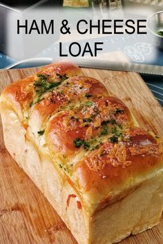 a loaf of ham and cheese loaf on a cutting board with the title overlay