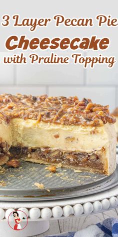 three layer pecan pie cheesecake with praline topping on a cake plate