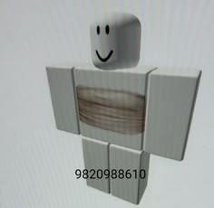 a small white object with a smiley face on it's head and two smaller square objects in the background