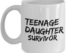 a white coffee mug with the words teenage daughter survivor on it