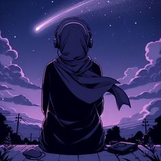 a person with headphones on looking at the stars