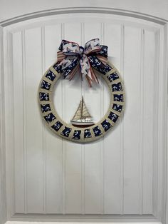 a sailboat wreath hangs on the front door