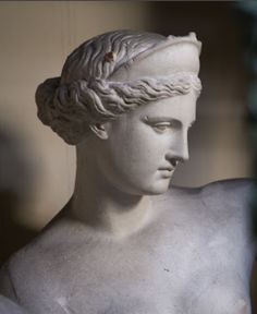 a statue of a woman with braids on her head