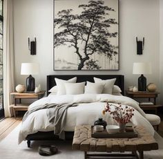 a bedroom with a large painting above the bed