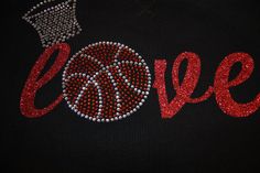 a black sweatshirt with red and silver sequins that says love on the front