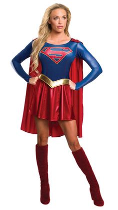 a woman in a superman costume posing for the camera with her hands on her hips