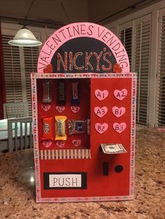 a valentine's vending machine with candy in it