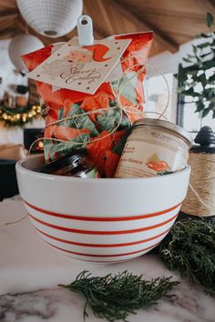 a white bowl filled with lots of different types of items on top of a table