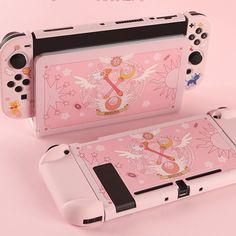 a pink nintendo wii game system with an angel design