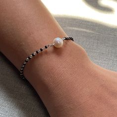 a person wearing a bracelet with a pearl on it Silver Mangalsutra, Mangalsutra Bracelet, Handcrafted Silver Jewelry, Silver Jewellery Indian, Mangalsutra Designs, Green Jewelry, Handmade Charms, Silver Accessories, Silver Bead